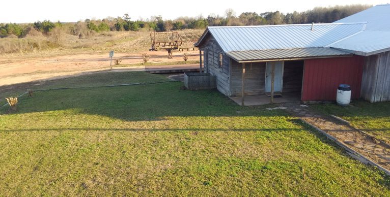 Organic farm with small house or barn