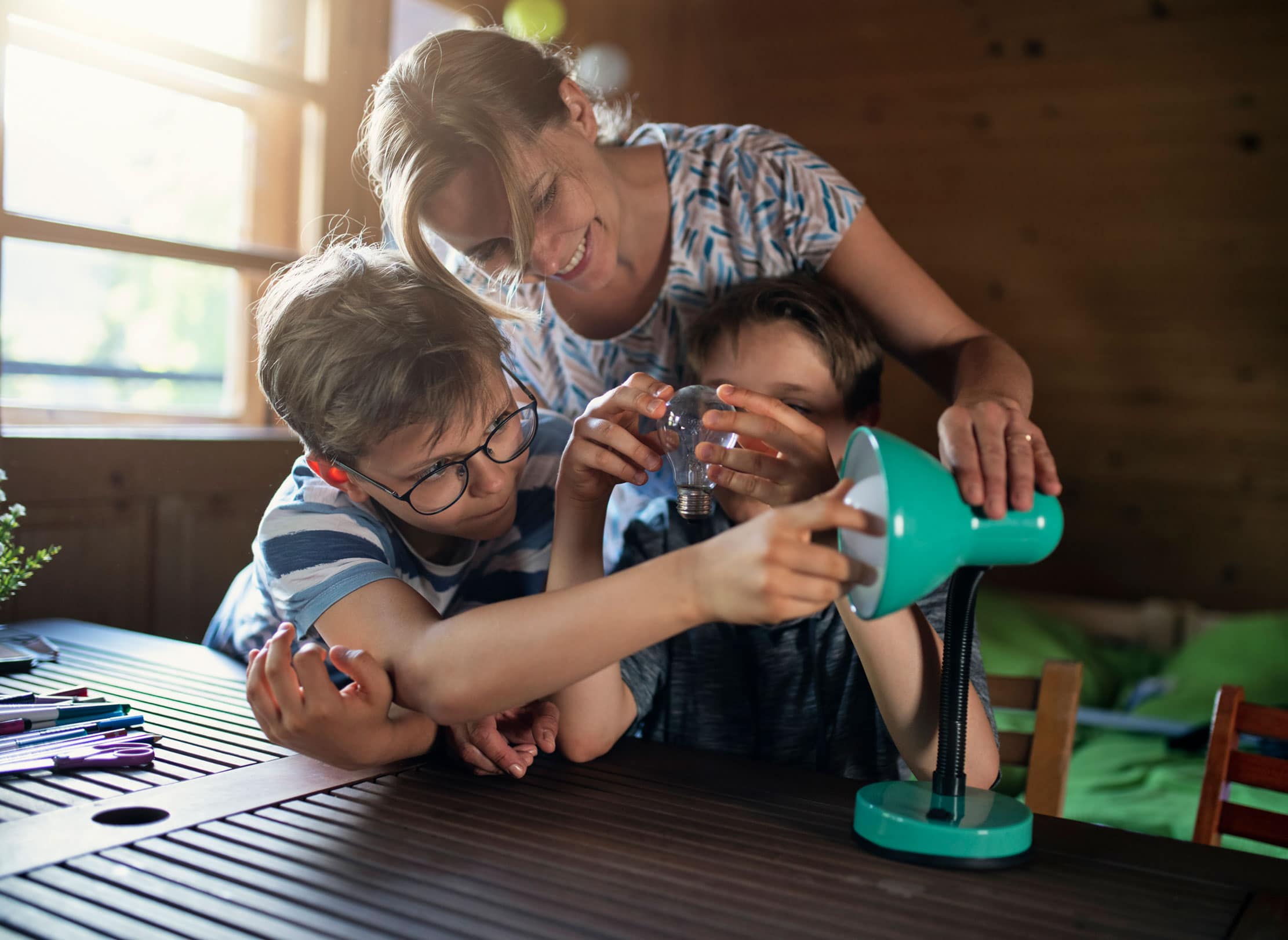 Family changing a light bulb