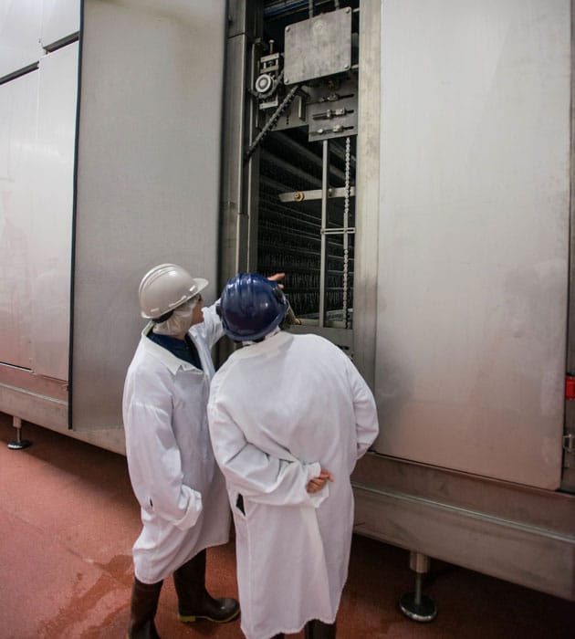 Looking inside refrigerator at McLeod manufacturing plant