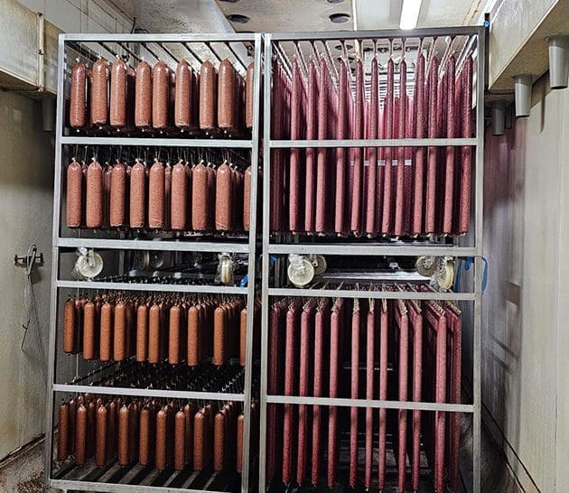 Dry-cured meat in drying room | Parma