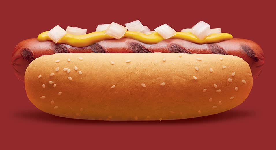 hot dog with mustard and onions