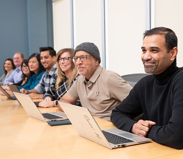 Omer, Zahid, Sylvia, Shivank, Agnes, Regina, Shane, Lejda, Diversity and inclusion - team sitting together in meeting room