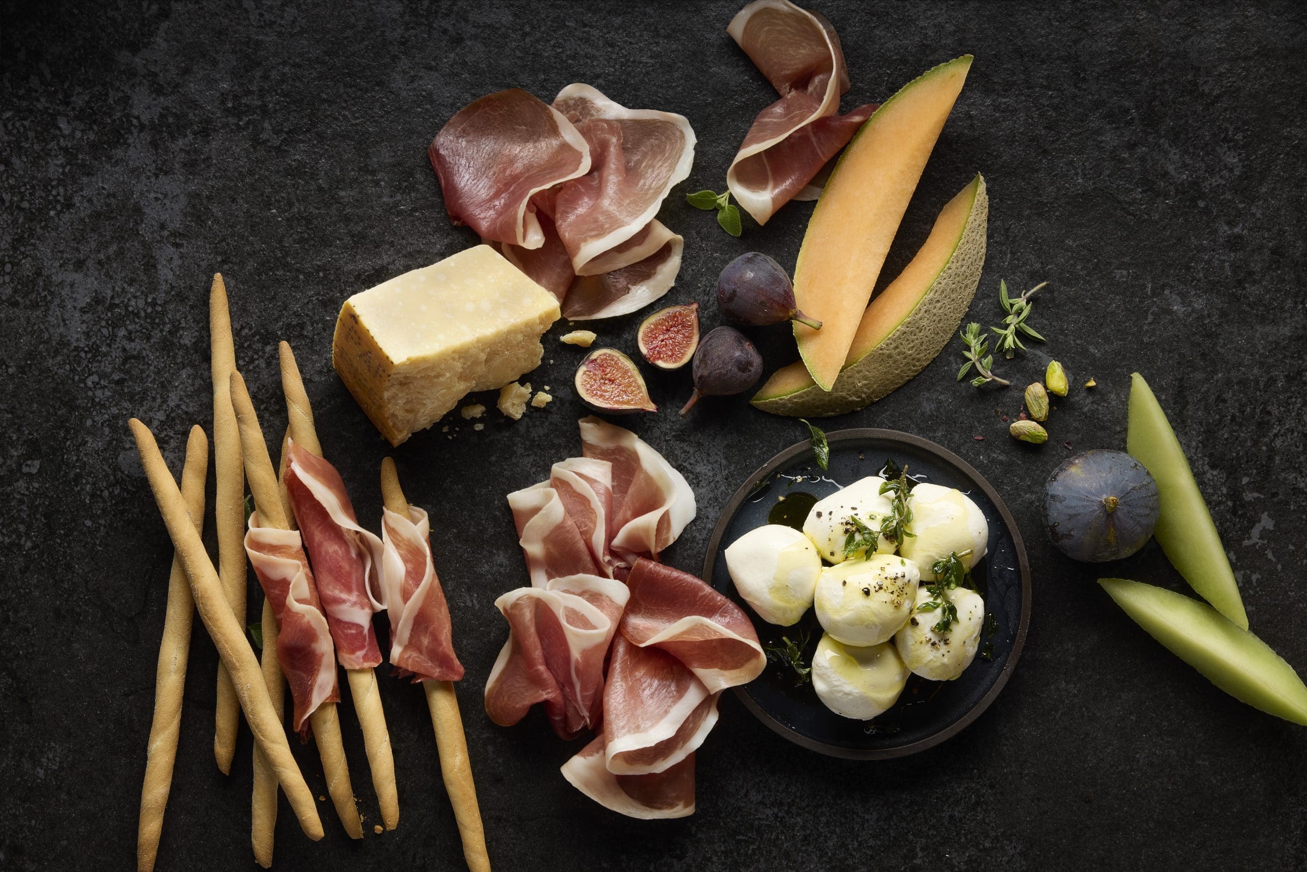 Prosciutto, cheeses, and cantaloupe and figs
