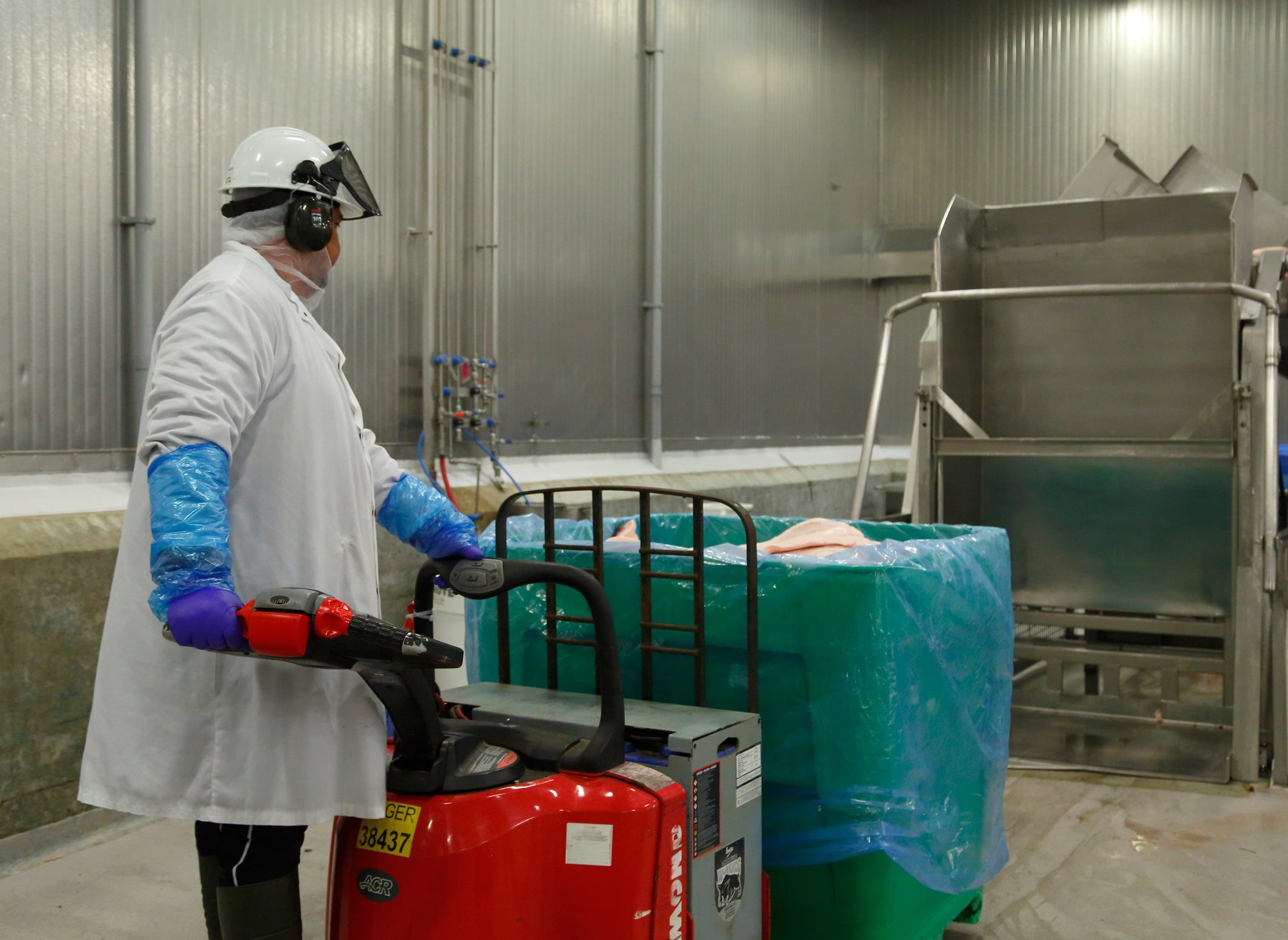 Man operating lift at Maple Leaf Foods Plant