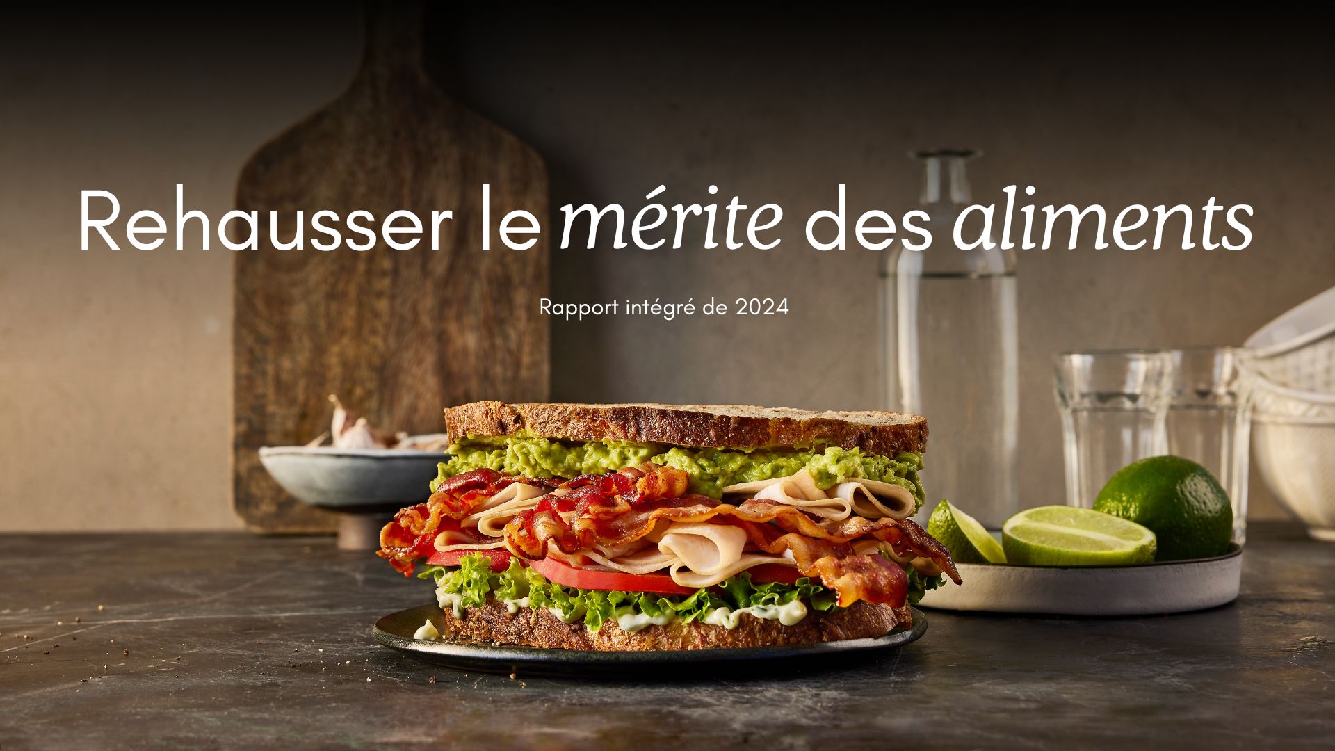 Photo of sandwich with bacon, turkey, lettuce, tomato, avocado.